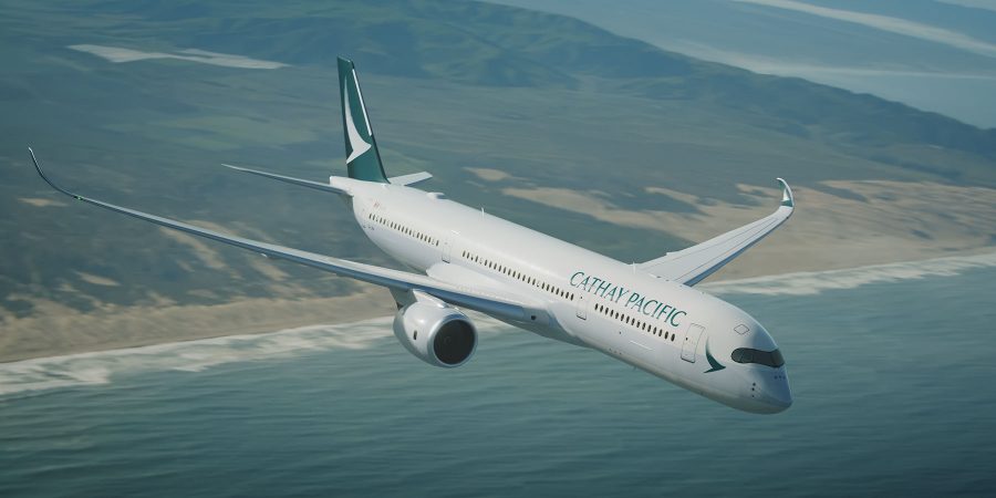 Cathay Pacific aircraft flying over a coastline